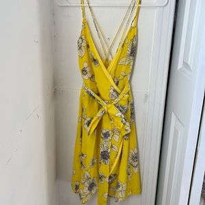 Size 6 summer/spring mini dress criss cross in front, comes with ribbon tie